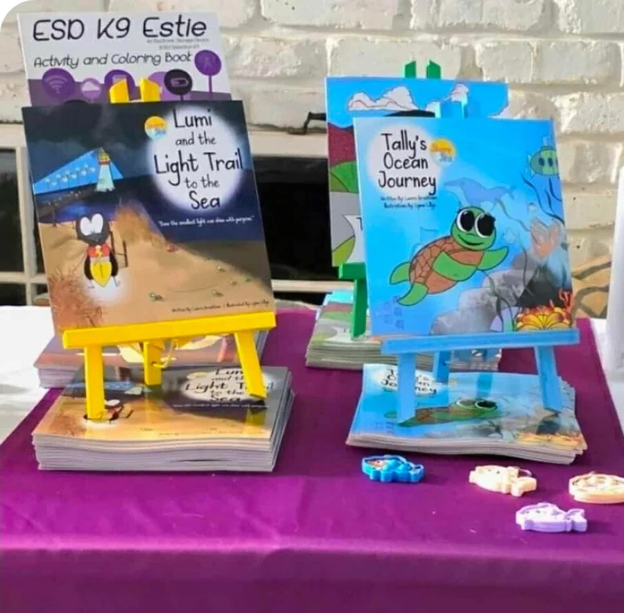 Shore and Sea books displayed at an event